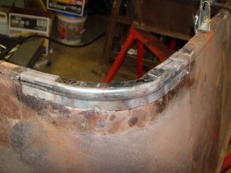Tonneau seat steel with new steel patch tacked in.