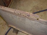 Bottom View of tonneau seat steel showing rusted area.